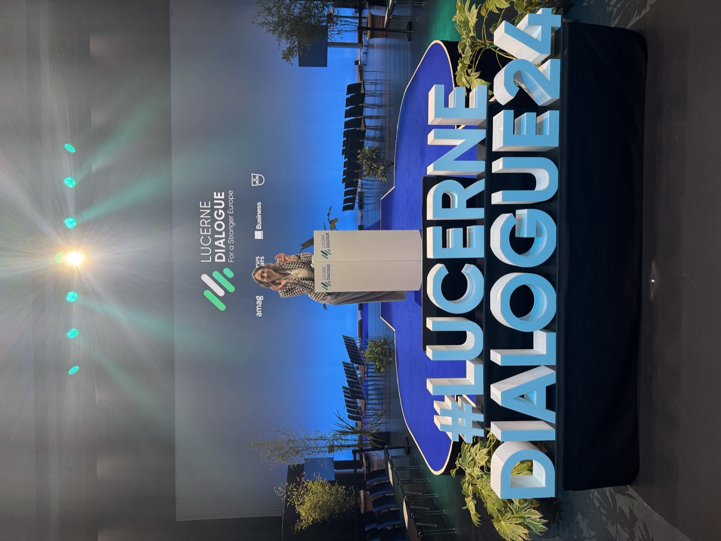 Shirley Werchota at the Lucerne Dialogue, in front of the ‘For a Stronger Europe’ backdrop